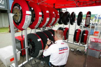 Ducati MotoGP wheels on rack wrapped with tire warmers